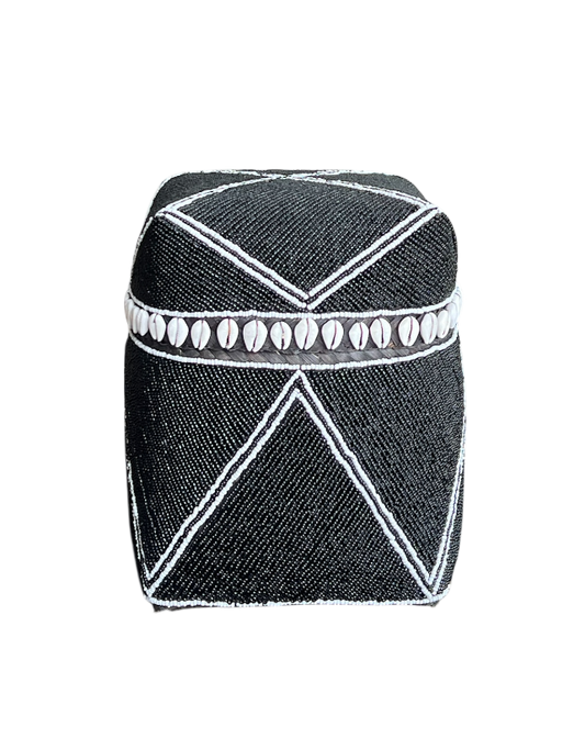 Black and white patterned cylindrical container on a white background