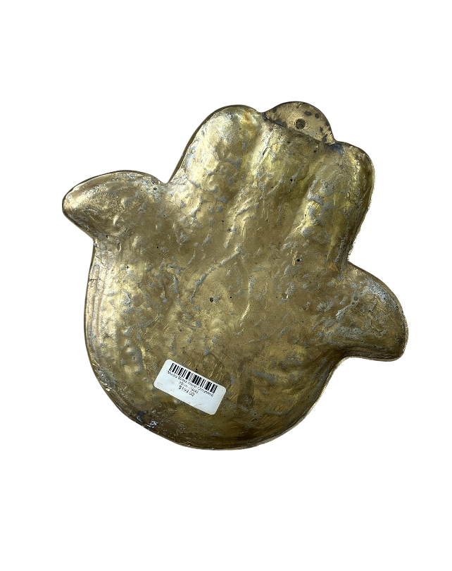 Bronze hand-shaped object with a barcode label on a white background