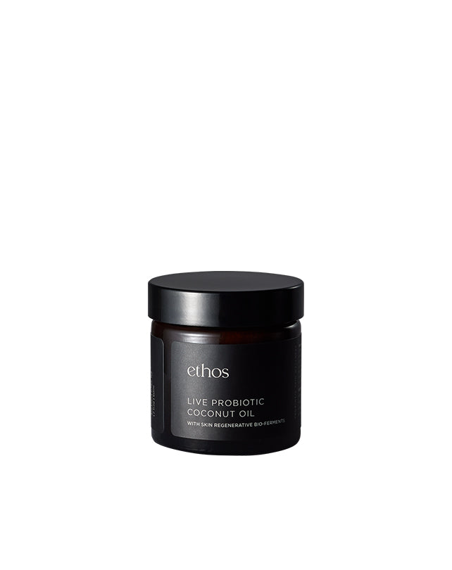 Black jar of ethos Live Probiotic Coconut Oil on a white background