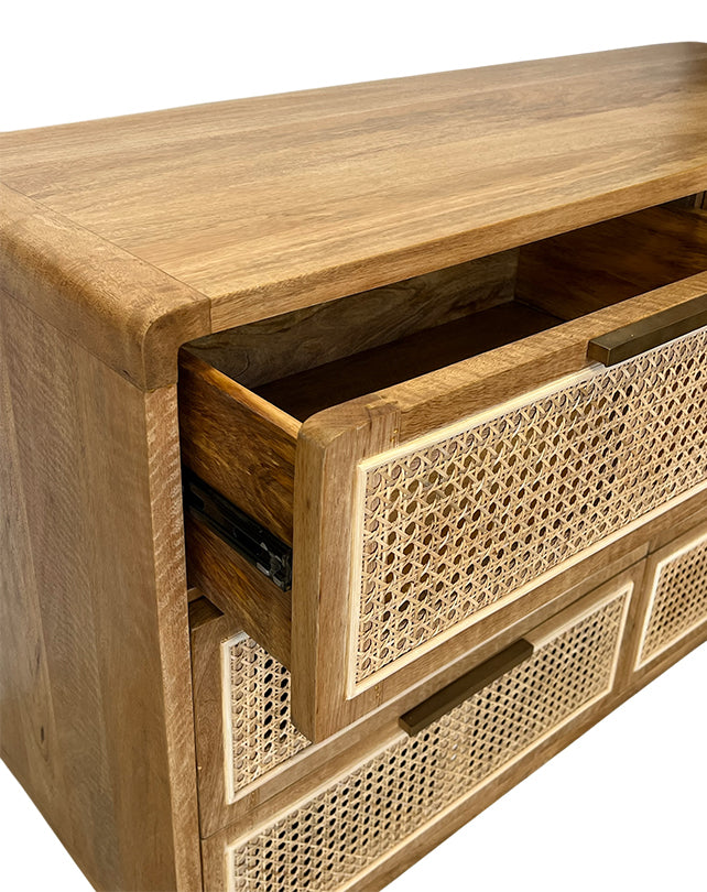 Wooden cabinet with wicker panels on a white background