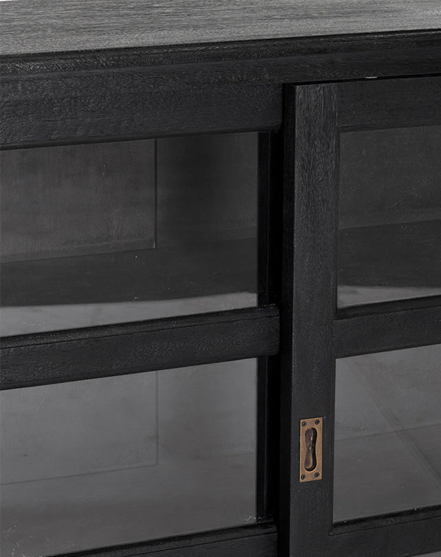 Dark wooden cabinet with a metal handle on a gray background
