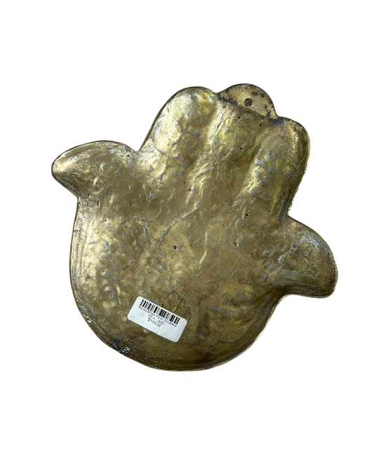 Bronze hand-shaped object with a barcode label on a white background