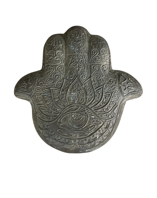 Decorative Hamsa hand with intricate patterns on a white background