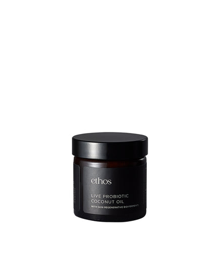 Black jar of ethos Live Probiotic Coconut Oil on a white background