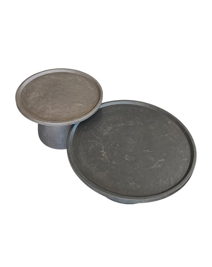 Two round stone-like objects on a white background