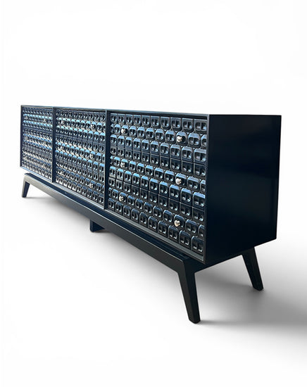 Modern black console table with glass front panels on a white background