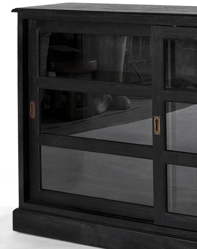 Black wooden cabinet with glass panels on a white background