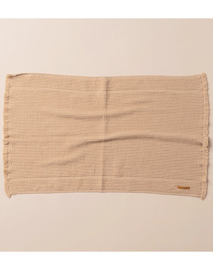 Beige woven placemat on a beige background